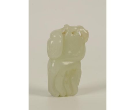 A CHINESE PALE CELADON JADE FINGER CITRON PENDANT naturalistically rendered hanging from a stalk flanked by a smaller fruit, 