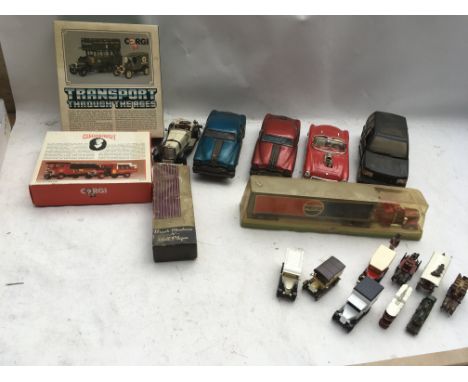 A collection of boxed and loose Diecast vehicles including 1:18 scale , Corgi and Lledo, also pull back friction drive tinpla