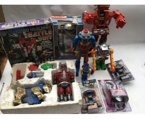 A box containing a collection of boxed/loose robots, including boxed Robo machine battle suit, Talk a tron robot, 3x carded C