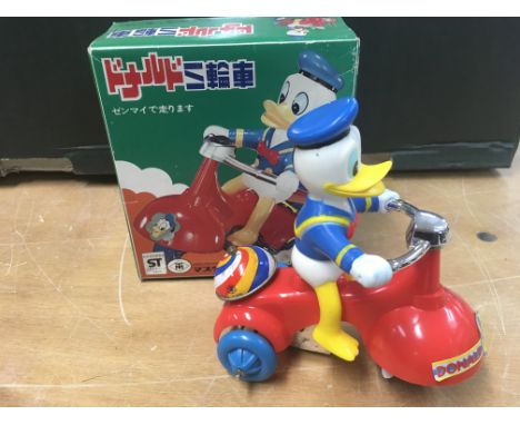 Walt Disney, Japanese boxed wind up Donald Duck on scooter