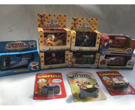 A collection of boxed and carded toys including ERTL Motorised Thomas the tank engine, Postman pats van and Fireman Sams Fire