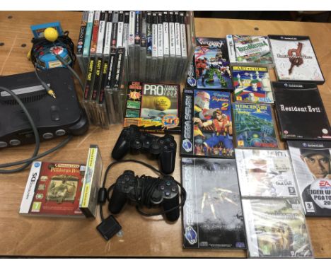 A box containing a collection of Vintage gaming including Nintendo games machine, games from game cube, Sega Saturn, PS1,2&am