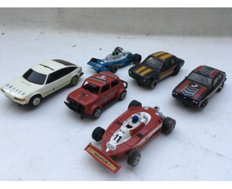 Scalextric, a collection of loose cars, including F1, Ford Escort, Ford Capri, Mini, Rover police car, all in need of some at