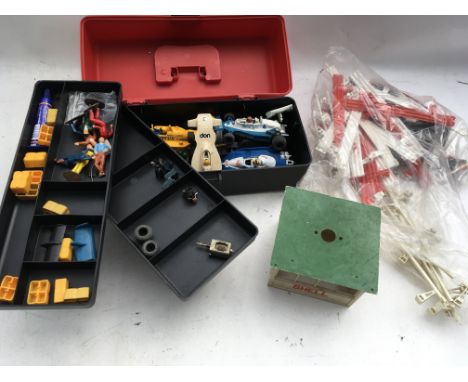 A collection of Scalextric parts including cars and accessories