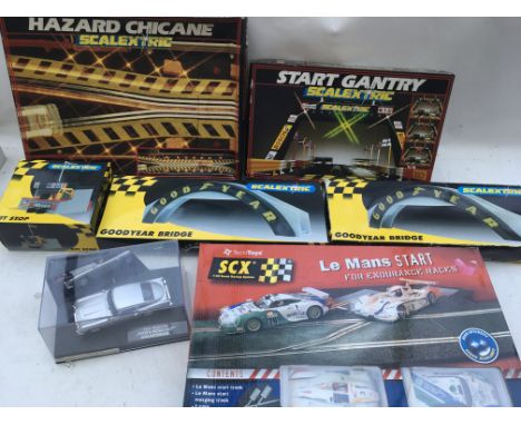 Scalextric, boxed including Hazard chicane, Start gantry, pit stop, Goodyear bridge, Aston Martin DB5 James Bond 007 Carrera 