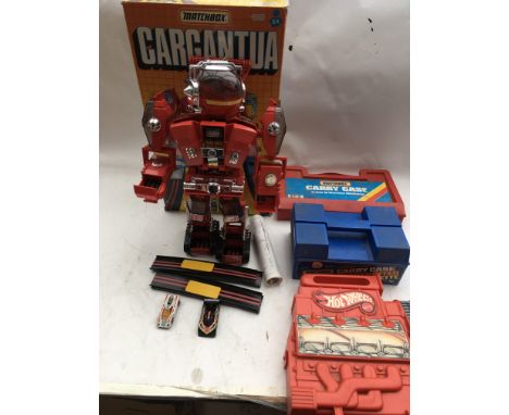 A collection of carry cases including Mattel Hot wheels and 2 matchbox cases, also Matchbox , boxed Cargantua, complete with 