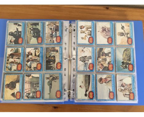 An Album containing a collection of Star Wars trading cards including vintage sets Blue and Red some green