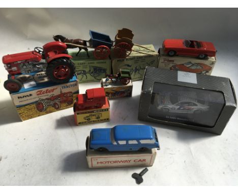 A box containing a collection of boxed Diecast vehicles including Zetor toys tractor ,Britains farm cart and horse, milk floa