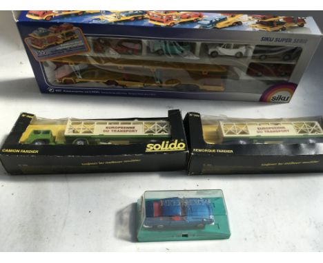A collection of boxed Diecast vehicles including a siku , #388 car transporter and cars, Solido, car transporter and Marklin 