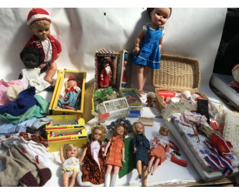 A box containing a collection of dolls including Sindy , Pelham puppet , clothes, picnic set and Britains plastic garden etc