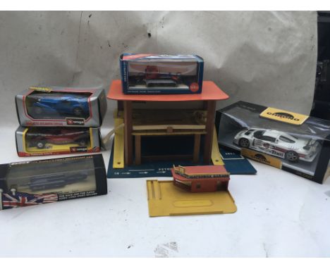 A collection of boxed Diecast vehicles including Burago 1:24 scale Bugatti and Ferrari, a Thrust supersonic car, a Chrono 1:1