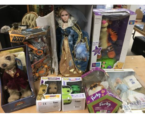 A collection of boxed toys including Talking Tigger, Peter Rabbit Barbie, Furby, Action man, Anne of Cleves doll, Alexander a