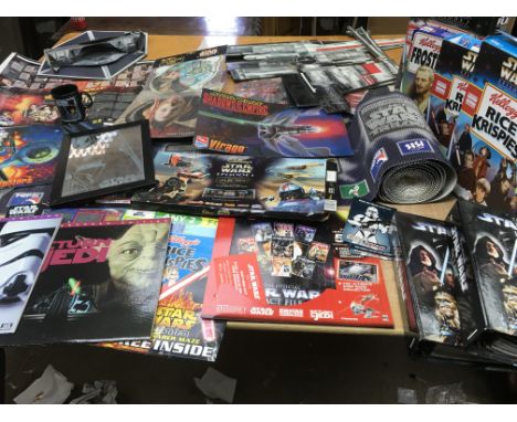 Star Wars, a box containing a collection of ephemera including 3 laser discs of the first 3 films, official fact files, vario