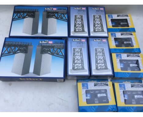 A box containing railway accessories including Kibri #39750 and 39753 HO scale viaduct pieces and 5x ESU switch pilots #51822