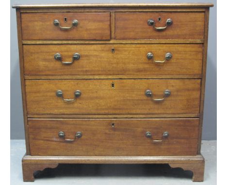 19TH CENTURY MAHOGANY STRAIGHT FRONT CHEST of two short and three long drawers having brass loop handles, standing on a mould