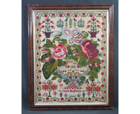 19TH CENTURY NEEDLEWORK TAPESTRY SAMPLER by Jane Hopkins, dated 1875, featuring a large still life study of a vase of flowers