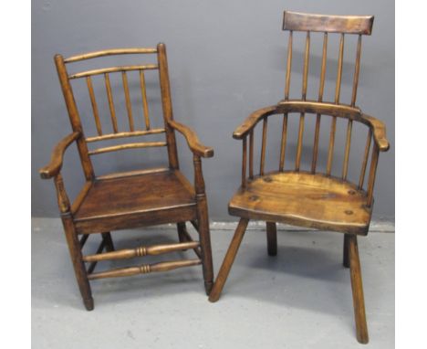 PRIMITIVE STYLE COMB AND STICK BACKED ELBOW CHAIR in mixed woods with moulded saddled seat and tapering turned legs. Together