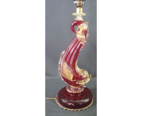 LARGE MURANO COLOURED GLASS TABLE LAMP in the form of a dolphin with clear and red glass and over gilded decoration. The lamp