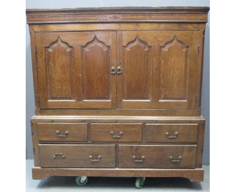 19TH CENTURY WELSH OAK LINEN PRESS CUPBOARD having moulded cornice above parquetry checkered inlaid decoration, the doors wit