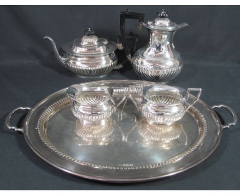 SILVER HALF LOBED BALUSTER SHAPED FOUR PIECE TEA AND COFFEE SERVICE comprising; coffee pot, teapot, cream jug and matching su