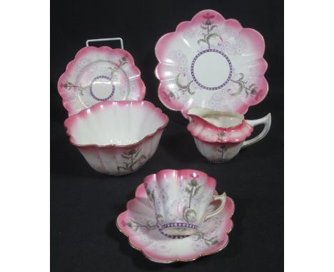 25 PIECE FOLEY CHINA WILEMAN & COMPANY TEA SERVICE overall on a white and pink gilded ground with fluted and thistle design, 