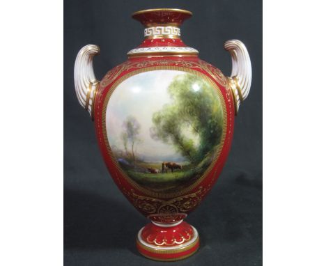 ROYAL WORCESTER PORCELAIN PAINTED TWO HANDLED BALUSTER VASE by Harry Davis, the oval vignette decorated with cattle in a land