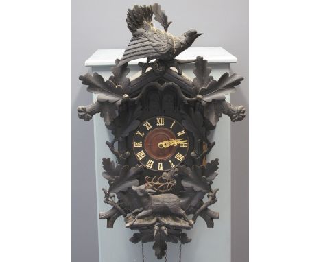 19TH CENTURY BAVARIAN DOUBLE AUTOMATON CUCKOO CLOCK the case overall with cuckoo and stag decoration with moulded oak leaves 