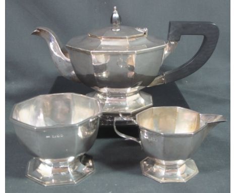 STERLING SILVER ART DECO THREE PIECE TEA SERVICE of geometric form comprising ; teapot, pedestal sucrier and pedestal cream j