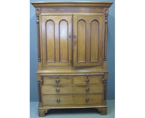 19TH CENTURY WELSH PALE OAK PRESS CUPBOARD the interior now converted into a wardrobe with hooks and poles, having moulded co