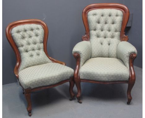 VICTORIAN MAHOGANY LADY'S AND GENTLEMAN'S FIRESIDE CHAIRS having button back upholstery with stylised foliate decoration serp