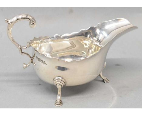 THOMAS BRADBURY &amp; SONS; a George V hallmarked silver sauce boat, Sheffield 1923, 4.05ozt/126g.
