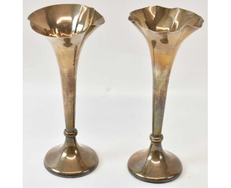 IS GREENBERG &amp; CO; a pair of Edward VII hallmarked silver trumpet form vases, Birmingham 1905, height 21cm.