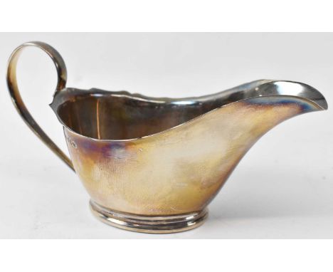 A George V hallmarked silver sauceboat, Sheffield 1931, 4.49ozt/ 139g.