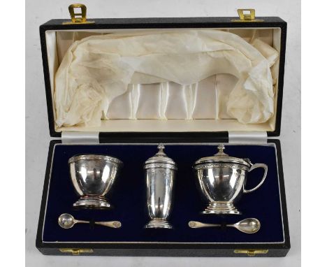 A CHICK &amp; SONS LTD; a cased hallmarked silver three piece cruet and spoons, London 1969, approx 4.89ozt/152g.