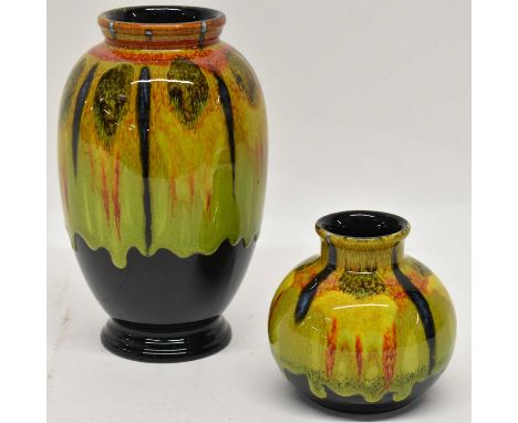 POOLE STUDIO; two green glazed vases, height 10 and 20cm.