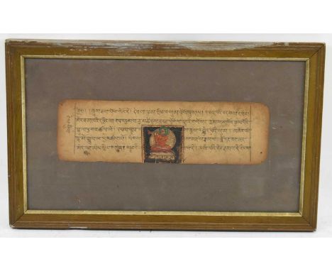 An Indian manuscript on parchment paper with a watercolour vignette depicting a figure of a seated deity, 29 x 9cm, framed.