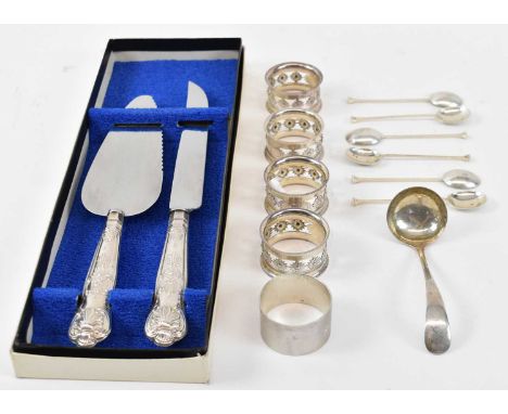 A set of four Birmingham hallmarked silver napkin rings, another napkin ring, a set of six coffee spoons, a small ladle, and 
