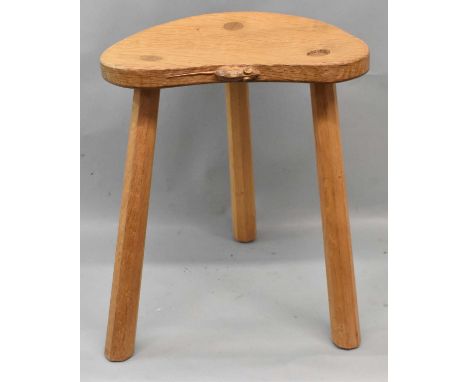 ROBERT 'MOUSEMAN' THOMPSON; an oak milking stool with trademark carved mouse, height 45cm.