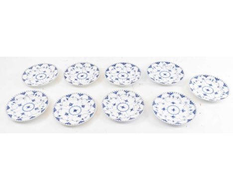 ROYAL COPENHAGEN; a set of nine blue and white lace edge plates, diameter 19cm (9).