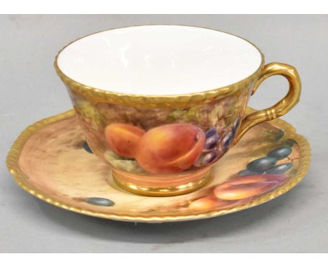ROYAL WORCESTER; a fruit painted cup and saucer, both signed, black printed marks.