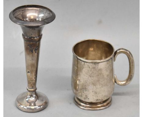 A George V hallmarked silver Christening mug, Chester 1914, and a small Birmingham hallmarked trumpet form vase (2).