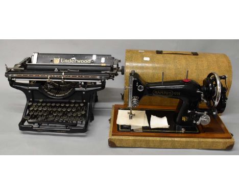 A vintage Underwood 14 typewriter and a Harris 9H sewing machine (2).
