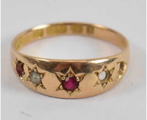 A 15ct yellow gold ruby and seed pearl five stone ring (two stone missings), size M, approx 1.7g.