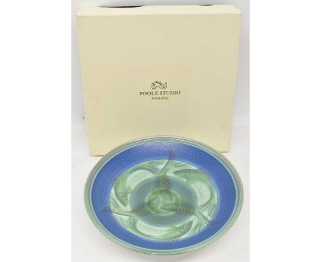 POOLE STUDIO; a charger decorated with fish, signed with initials 'NM 98; diameter 35cm, boxed.