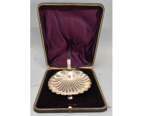 HILLIARD &amp; THOMASON; a late Victorian hallmarked silver shell shaped dish with scroll handle and three ball feet, cased, 