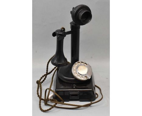 A vintage candlestick telephone with bell box.