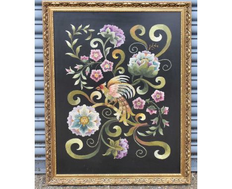 A tapestry depicting exotic bird amongst scrolling foliage, 81.5 x 61cm, in gilt frame.