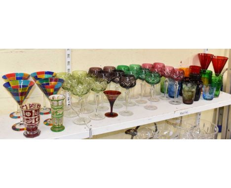 A collection of assorted coloured glassware including Bohemian ruby flash cut vase, height 12cm, a green and clear example, s