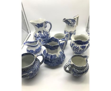 A Collection of 1800s & 1900s blue and white ceramic wares, to include Masons dragon design jug, Spode jugs, Ironstone Broadh