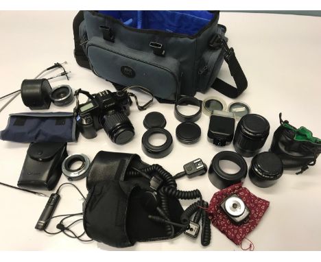 Canon EOS 1000 Camera with various lenses and accessories. Comes with Jessop carry bag. 